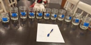 Jars of moonshine on table for blending and tasting