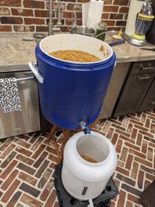 transfer-bourbon-mash-fermenter transferring caramel bourbon mash from mash tun to fermenter